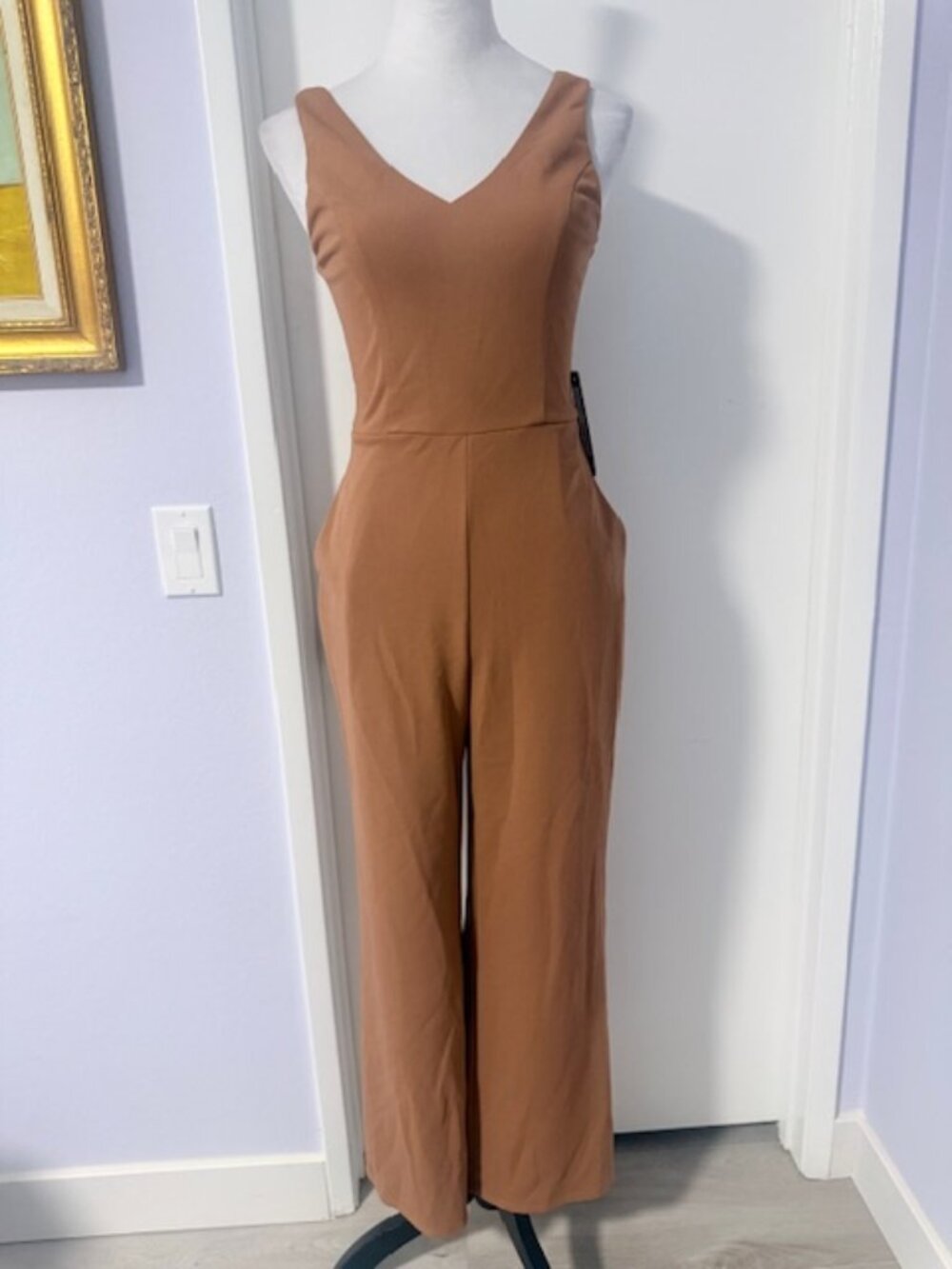 Bebe scuba jumpsuit with pockets.